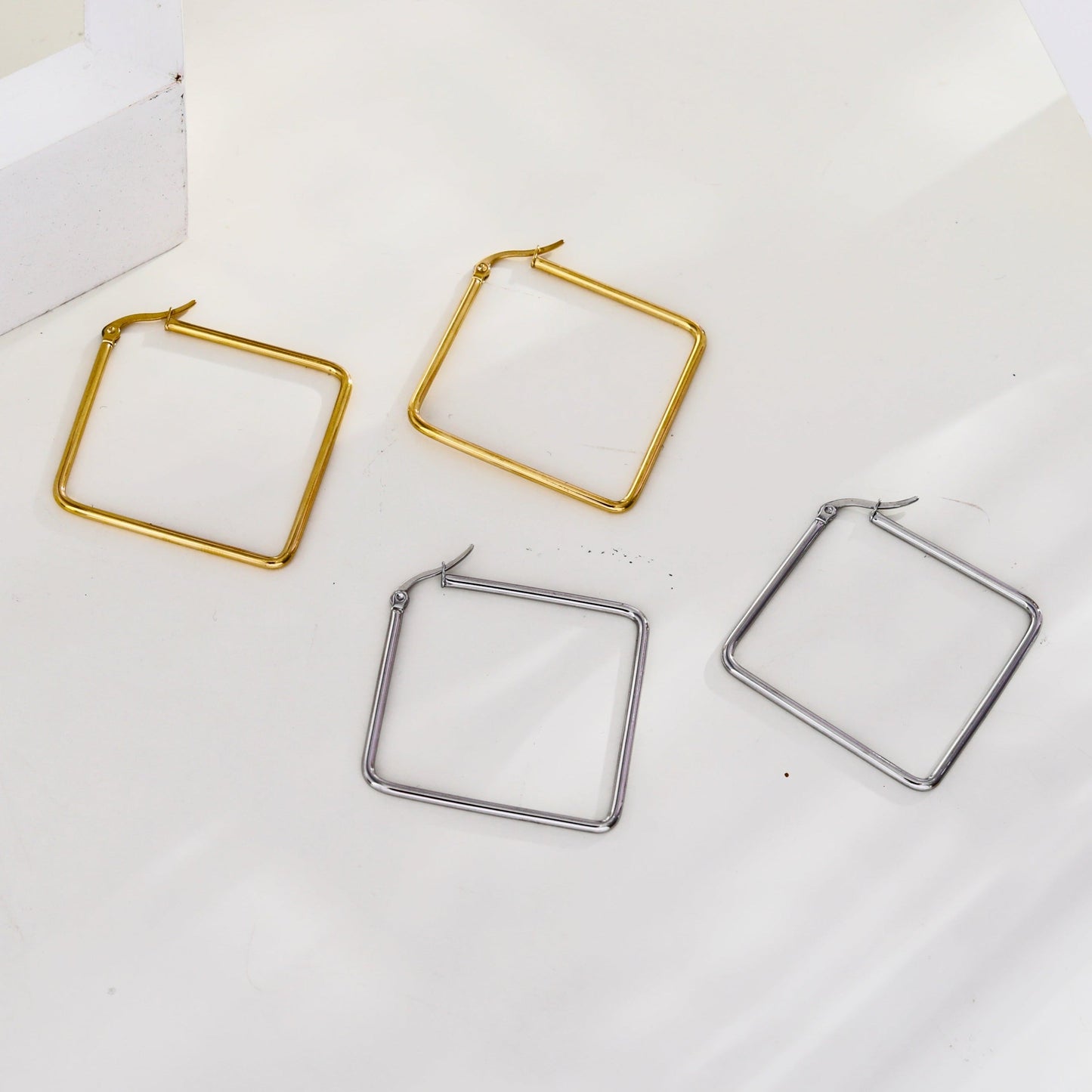 REILYNN: Square Silver Hoops - A Bold Twist on Classic Elegance - Velora