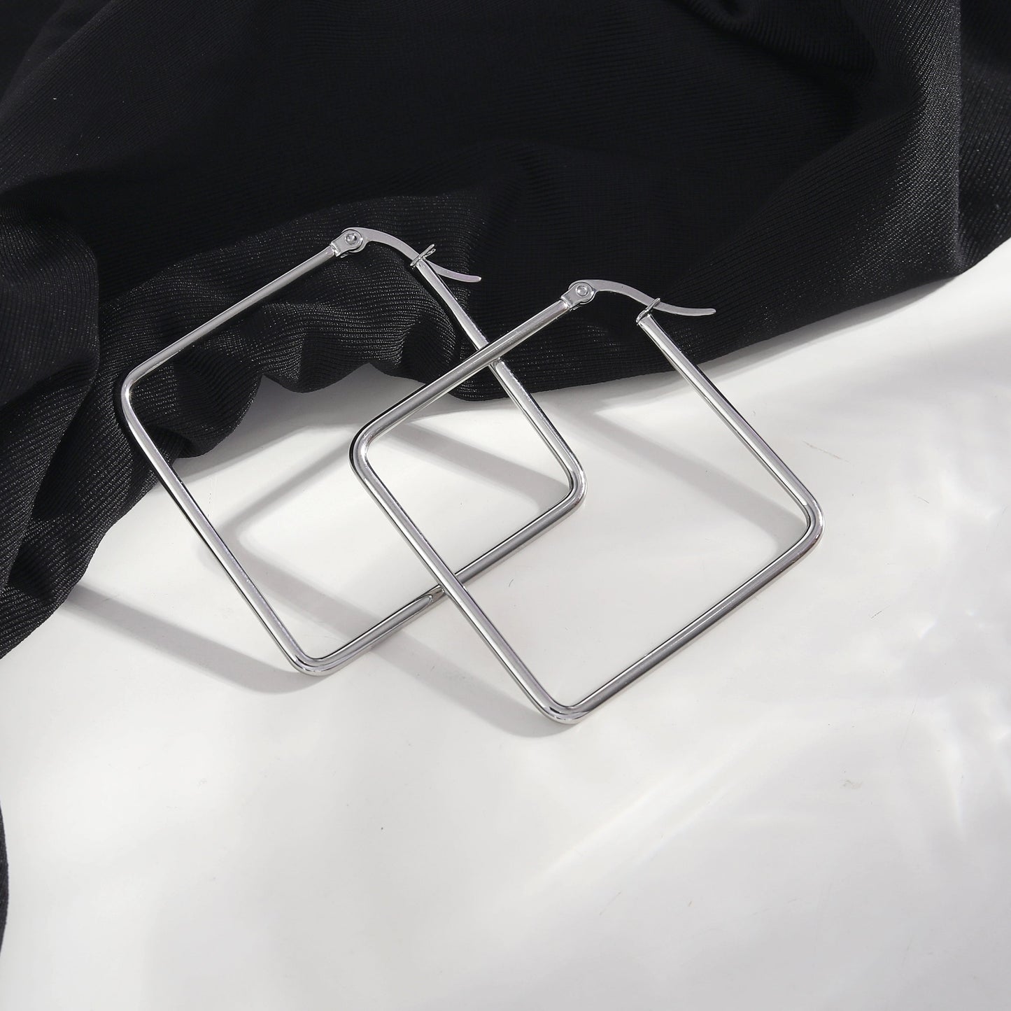 REILYNN: Square Silver Hoops - A Bold Twist on Classic Elegance - Velora