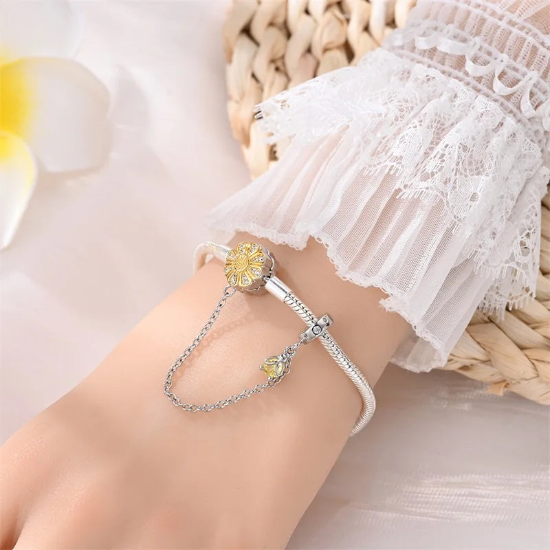 Radiant Daisy Sterling Silver Charm Bracelet With Dangling Chain - Velora