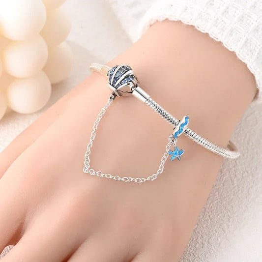 Sterling Silver Seashell Charm Bracelet with Blue CZ Gradient - Velora Luxury Fashion