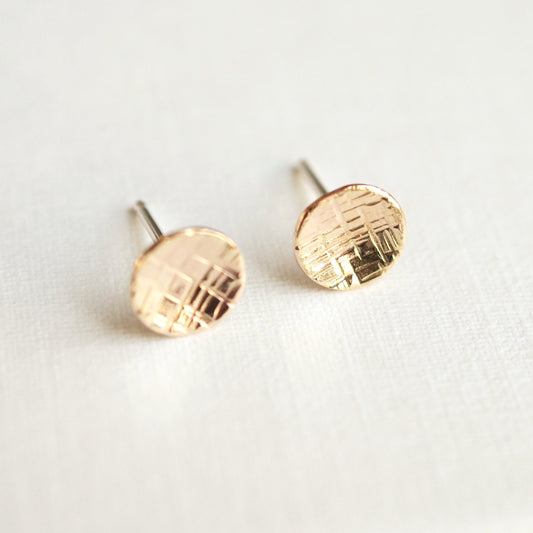 Small round silver or gold studs
