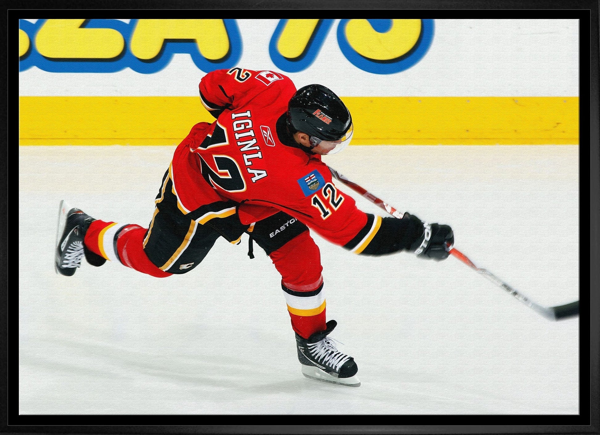 Jarome Iginla 20x29 Framed Canvas Flames Shooting-H Frameworth Sports Marketing