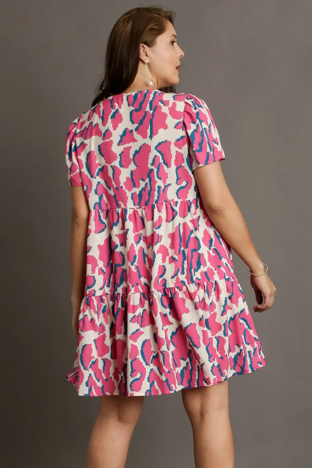 Umgee Full Size Abstract Print Pleat Detail Short Sleeve V-Neck Tiered Dress Plus Size - Velora