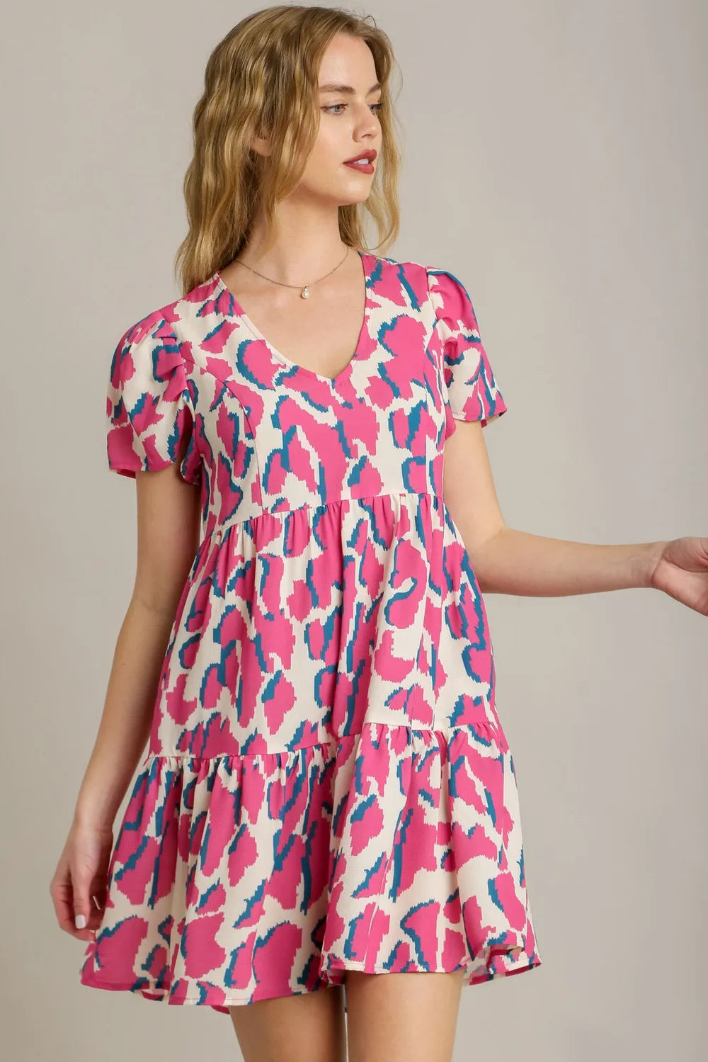 Umgee Full Size Abstract Print Pleat Detail Short Sleeve V-Neck Tiered Dress Plus Size - Velora